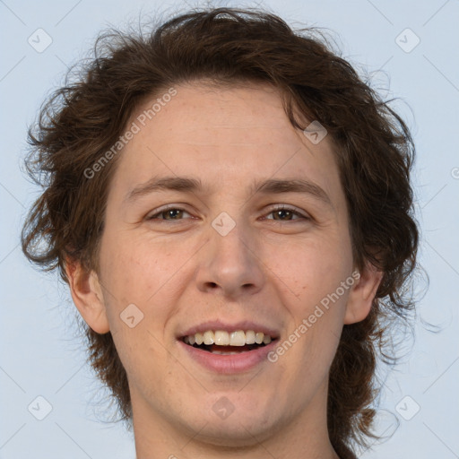 Joyful white adult male with medium  brown hair and brown eyes