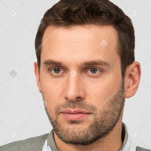 Neutral white young-adult male with short  brown hair and brown eyes