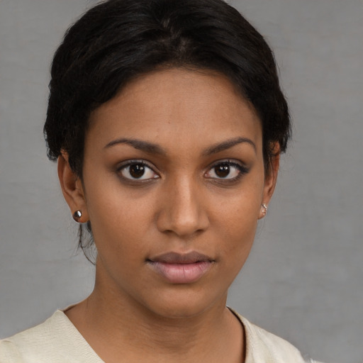 Neutral black young-adult female with short  brown hair and brown eyes