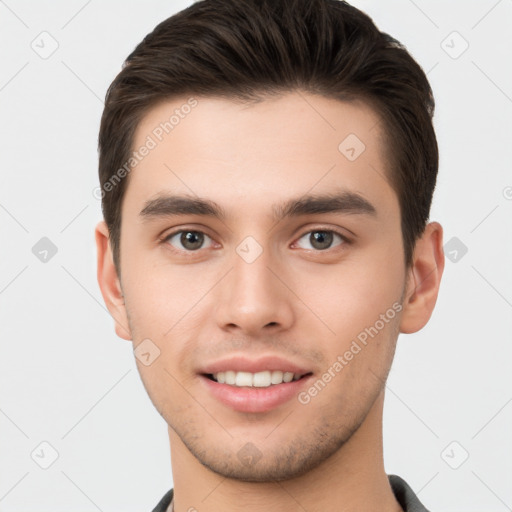 Joyful white young-adult male with short  brown hair and brown eyes