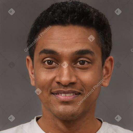 Joyful black young-adult male with short  black hair and brown eyes