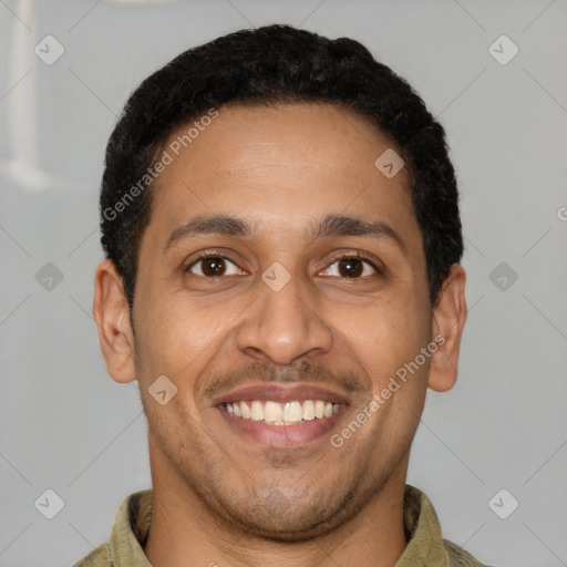 Joyful latino young-adult male with short  brown hair and brown eyes