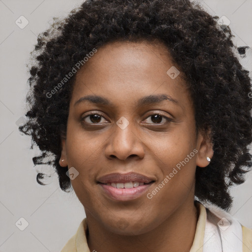 Joyful black young-adult female with long  brown hair and brown eyes