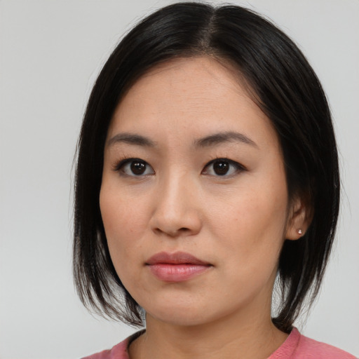 Neutral asian young-adult female with medium  black hair and brown eyes