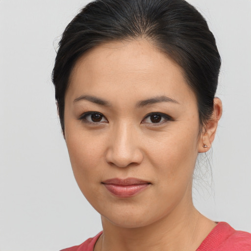 Joyful asian young-adult female with medium  brown hair and brown eyes
