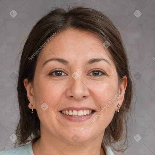 Joyful white adult female with medium  brown hair and grey eyes