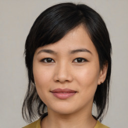 Joyful asian young-adult female with medium  black hair and brown eyes