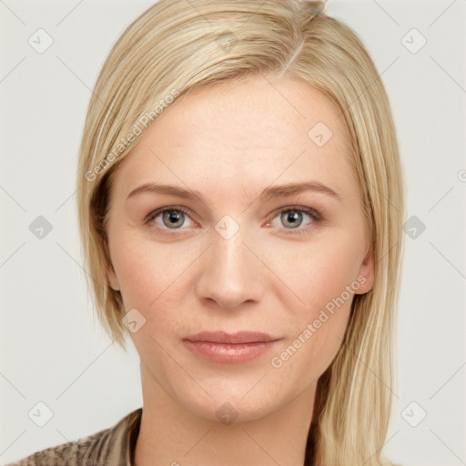 Joyful white young-adult female with medium  brown hair and blue eyes