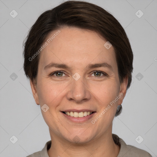 Joyful white adult female with short  brown hair and grey eyes