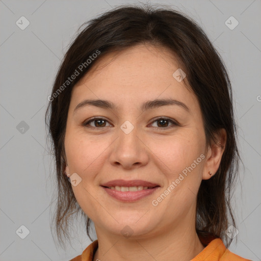 Joyful white young-adult female with medium  brown hair and brown eyes