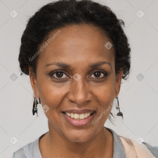 Joyful black adult female with short  brown hair and brown eyes