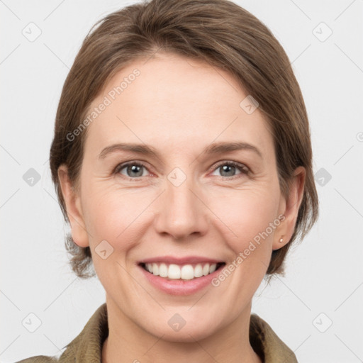 Joyful white young-adult female with medium  brown hair and grey eyes