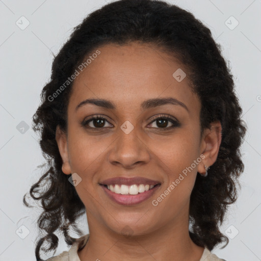 Joyful black young-adult female with medium  brown hair and brown eyes