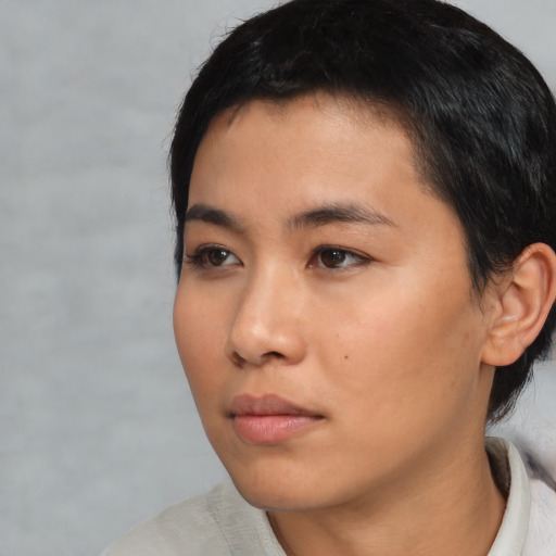 Neutral black young-adult female with short  black hair and brown eyes