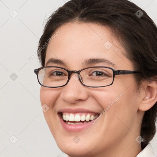 Joyful white young-adult female with medium  brown hair and brown eyes