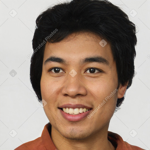 Joyful asian young-adult male with short  black hair and brown eyes