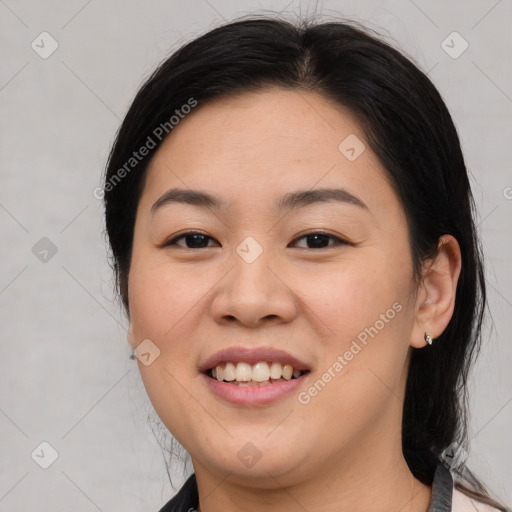 Joyful asian young-adult female with medium  black hair and brown eyes