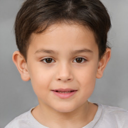Joyful white child male with short  brown hair and brown eyes