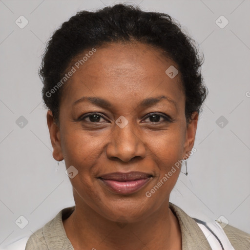 Joyful black adult female with short  brown hair and brown eyes