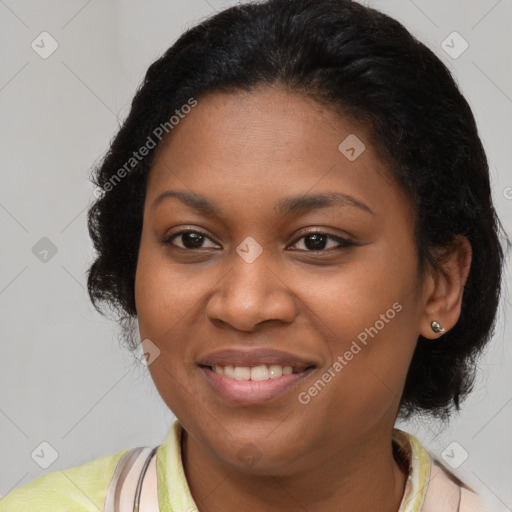 Joyful black young-adult female with medium  brown hair and brown eyes