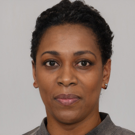 Neutral black adult female with short  black hair and brown eyes