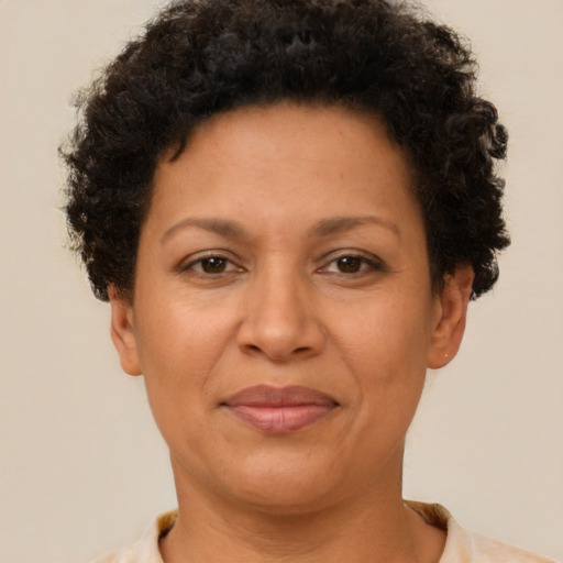 Joyful latino adult female with short  brown hair and brown eyes