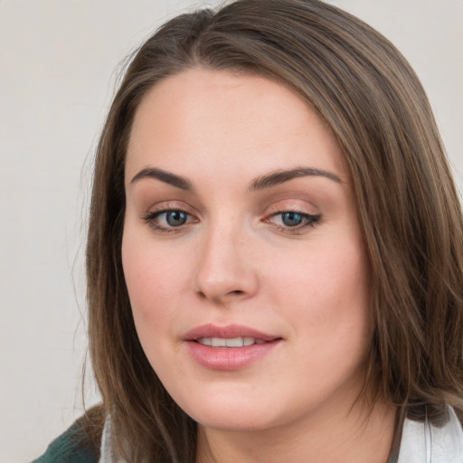 Neutral white young-adult female with medium  brown hair and green eyes