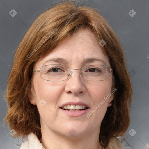 Joyful white adult female with medium  brown hair and blue eyes