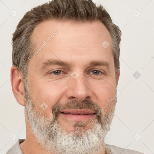 Joyful white adult male with short  brown hair and grey eyes