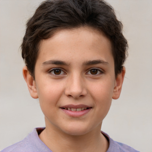 Joyful white child male with short  brown hair and brown eyes