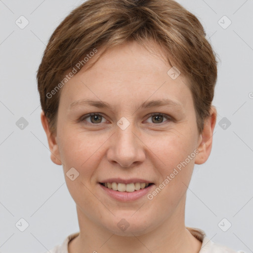 Joyful white young-adult female with short  brown hair and grey eyes