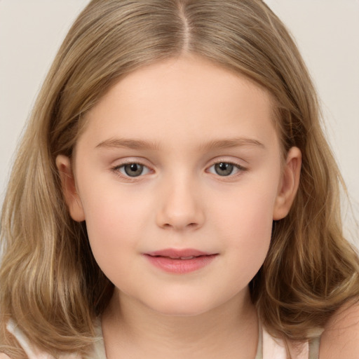 Joyful white child female with long  brown hair and brown eyes