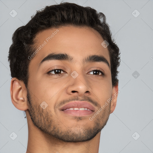 Joyful latino young-adult male with short  brown hair and brown eyes