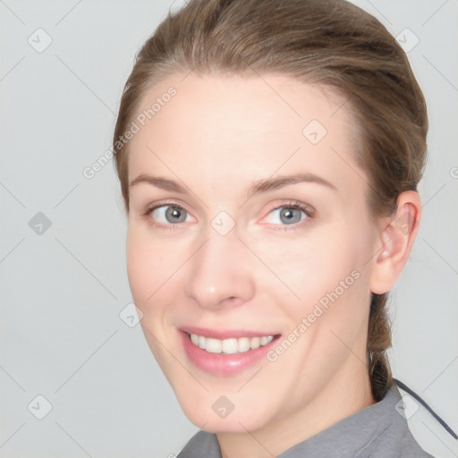 Joyful white young-adult female with medium  brown hair and blue eyes