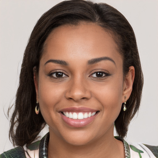 Joyful white young-adult female with medium  brown hair and brown eyes