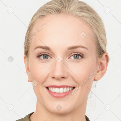 Joyful white young-adult female with medium  brown hair and blue eyes