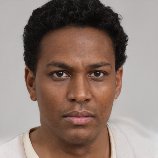 Neutral black young-adult male with short  brown hair and brown eyes