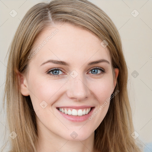 Joyful white young-adult female with long  brown hair and blue eyes