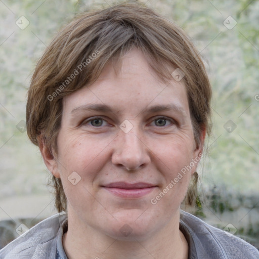 Joyful white adult female with medium  brown hair and grey eyes