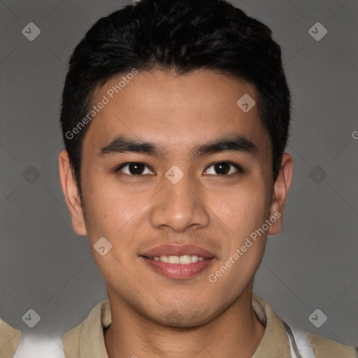 Joyful latino young-adult male with short  brown hair and brown eyes