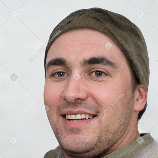 Joyful white young-adult male with short  black hair and brown eyes