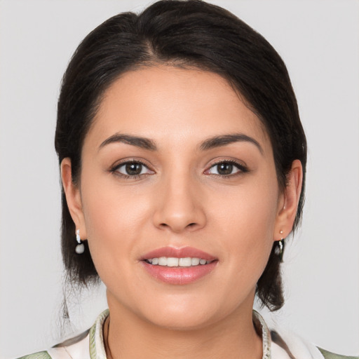 Joyful white young-adult female with medium  brown hair and brown eyes