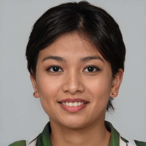 Joyful asian young-adult female with medium  brown hair and brown eyes