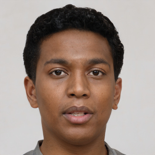 Neutral black young-adult male with short  black hair and brown eyes