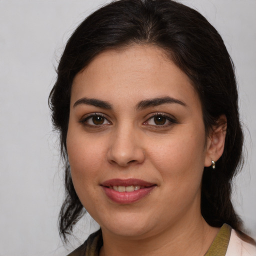 Joyful white young-adult female with medium  brown hair and brown eyes