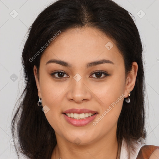 Joyful latino young-adult female with long  brown hair and brown eyes