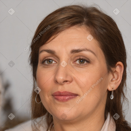 Joyful white adult female with medium  brown hair and brown eyes