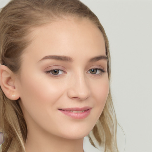 Joyful white young-adult female with long  brown hair and blue eyes