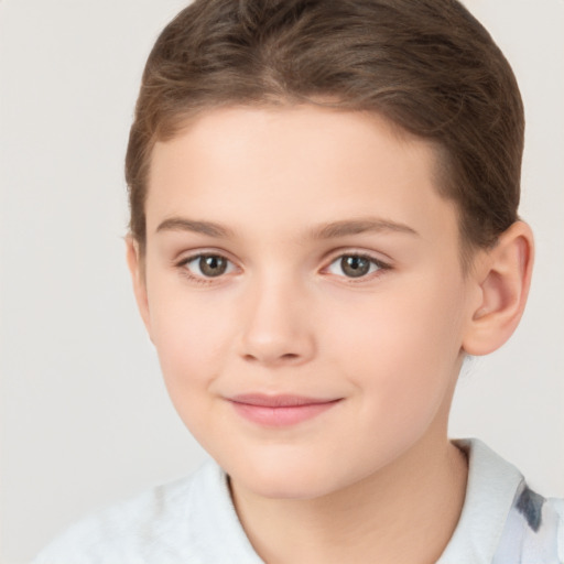 Joyful white child female with short  brown hair and brown eyes