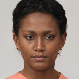 Neutral black young-adult female with short  brown hair and brown eyes